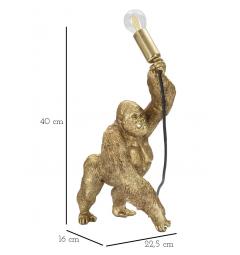 Lampada da tavolo in resina dorata a forma di gorilla che tiene in mano la lampadina