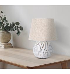 Lampada da tavolo in resina con eleganti decorazioni lineari in rilievo. Completa di paralume in tessuto beige