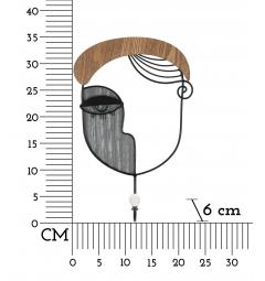 Appendiabiti in metallo e legno a forma di volto che richiama l'arte cubista
