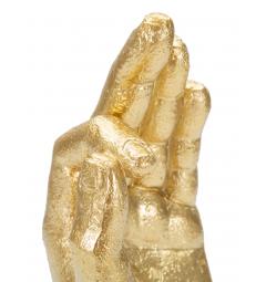 Statua dorata a forma di mano nel gesto dell'ok