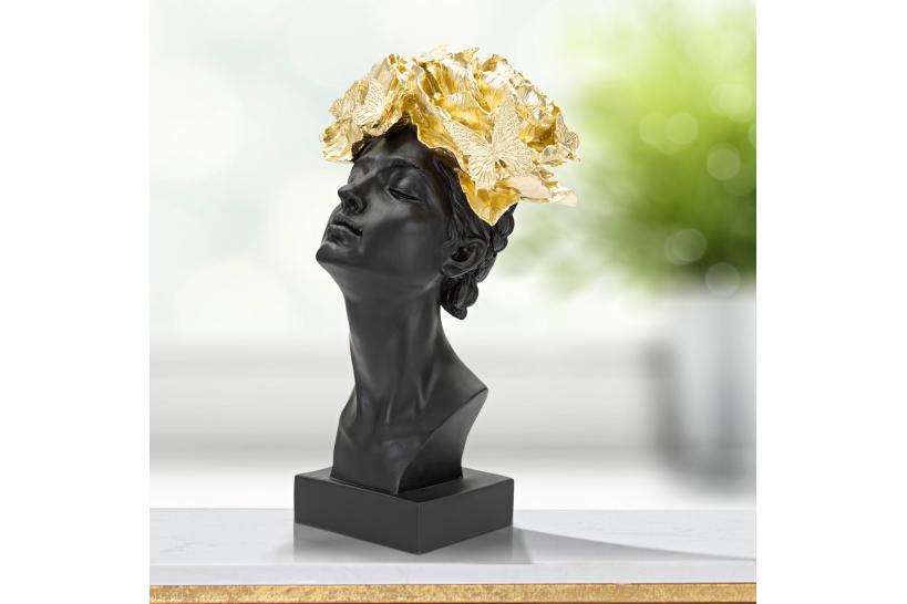 Statua a forma di testa di donna con copricapo dorato composto da foglie e farfalle