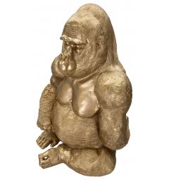 Statua dorata a forma di gorilla seduto