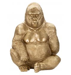 Statua dorata a forma di gorilla seduto