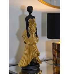 Statuetta a forma di donna con elegante vestito da sera dorato