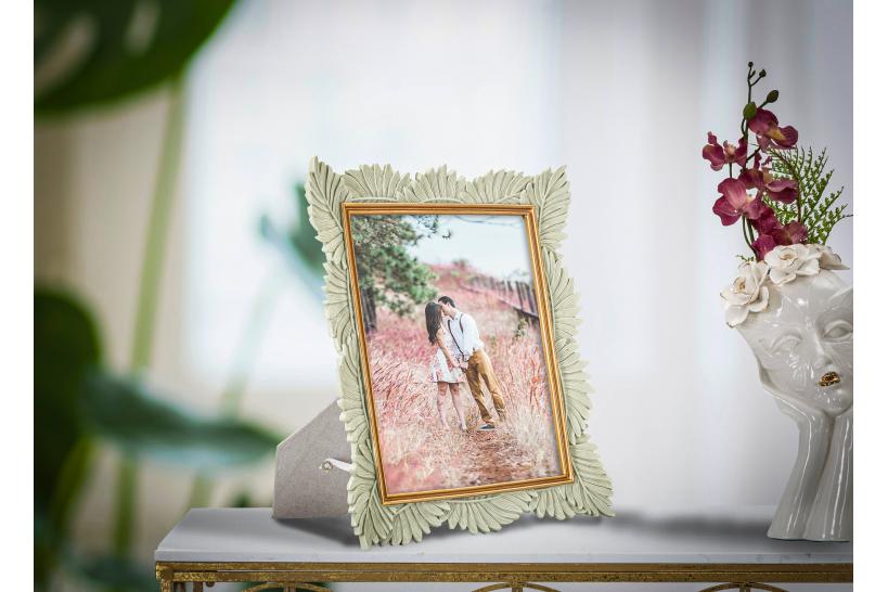 Elegante portafoto con cornice decorata da foglie